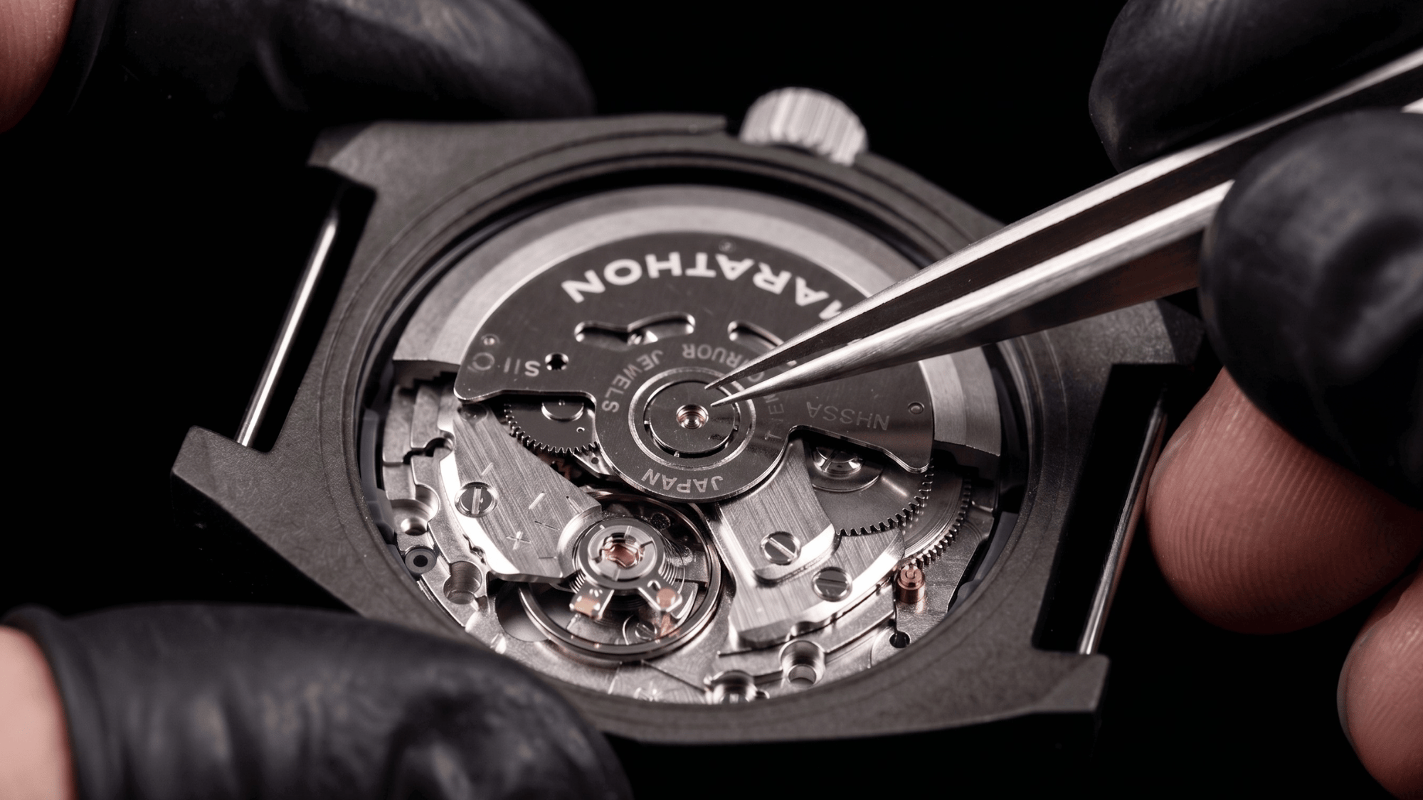 Marathon watch caseback featuring official military specification and government contract engravings.