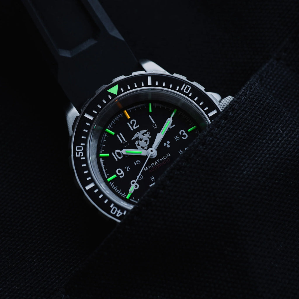 Marathon GSAR Automatic 41mm USMC Edition with illuminated markers partially tucked into black fabric