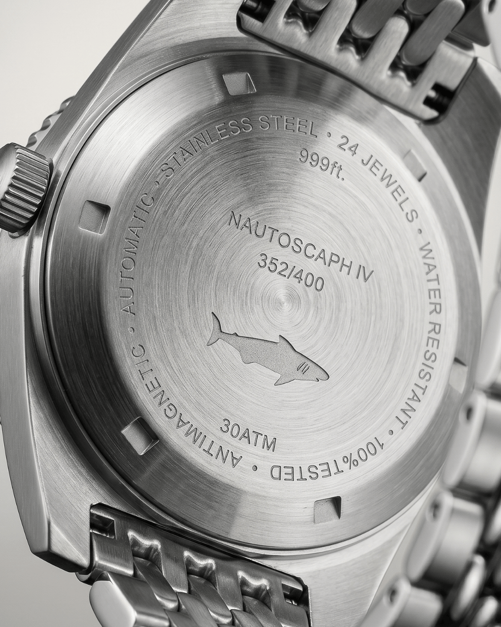 Engraved steel caseback of the Alsta Nautoscaph automatic watch showing the iconic shark logo
