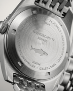 Engraved steel caseback of the Alsta Nautoscaph automatic watch showing the iconic shark logo