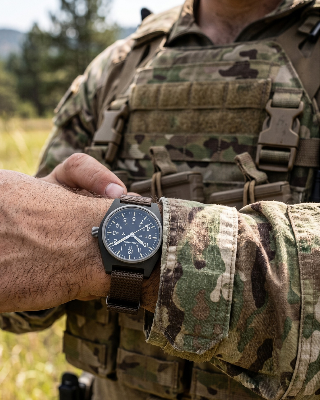A tactical operator wearing the Marathon Sage Green GPM on a nylon strap. Built for ground operations and high-impact durability. Field Mechanical, Type II.