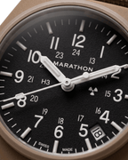 Close-up of the 34mm GPQ-D Tritium dial. Swiss quartz watches for men nearby at Tempohaus.